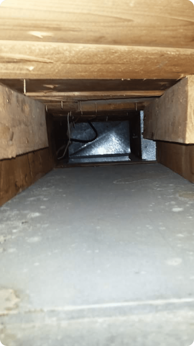 Narrow attic view with metal ductwork