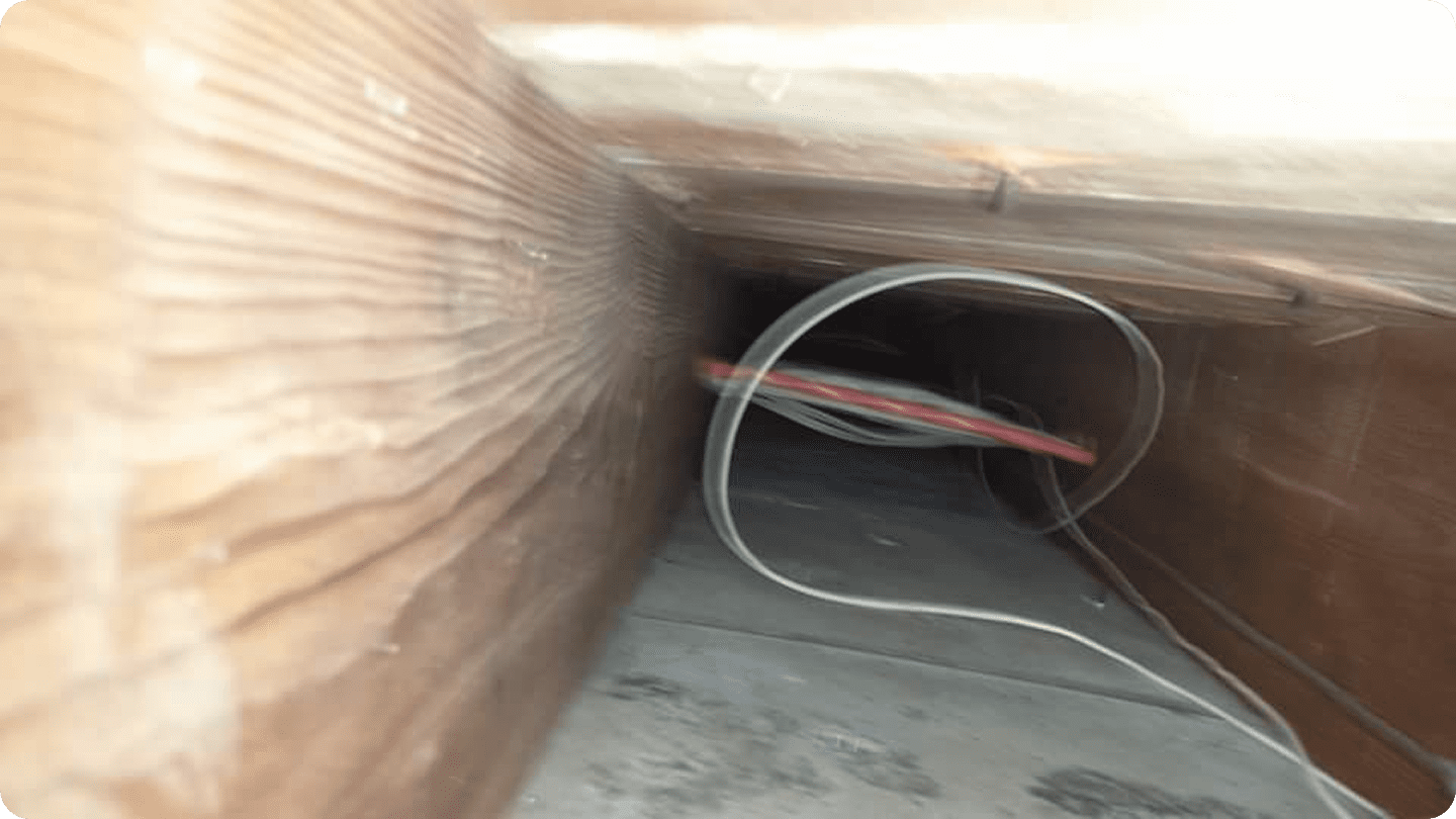 Wooden vent with visible wires inside